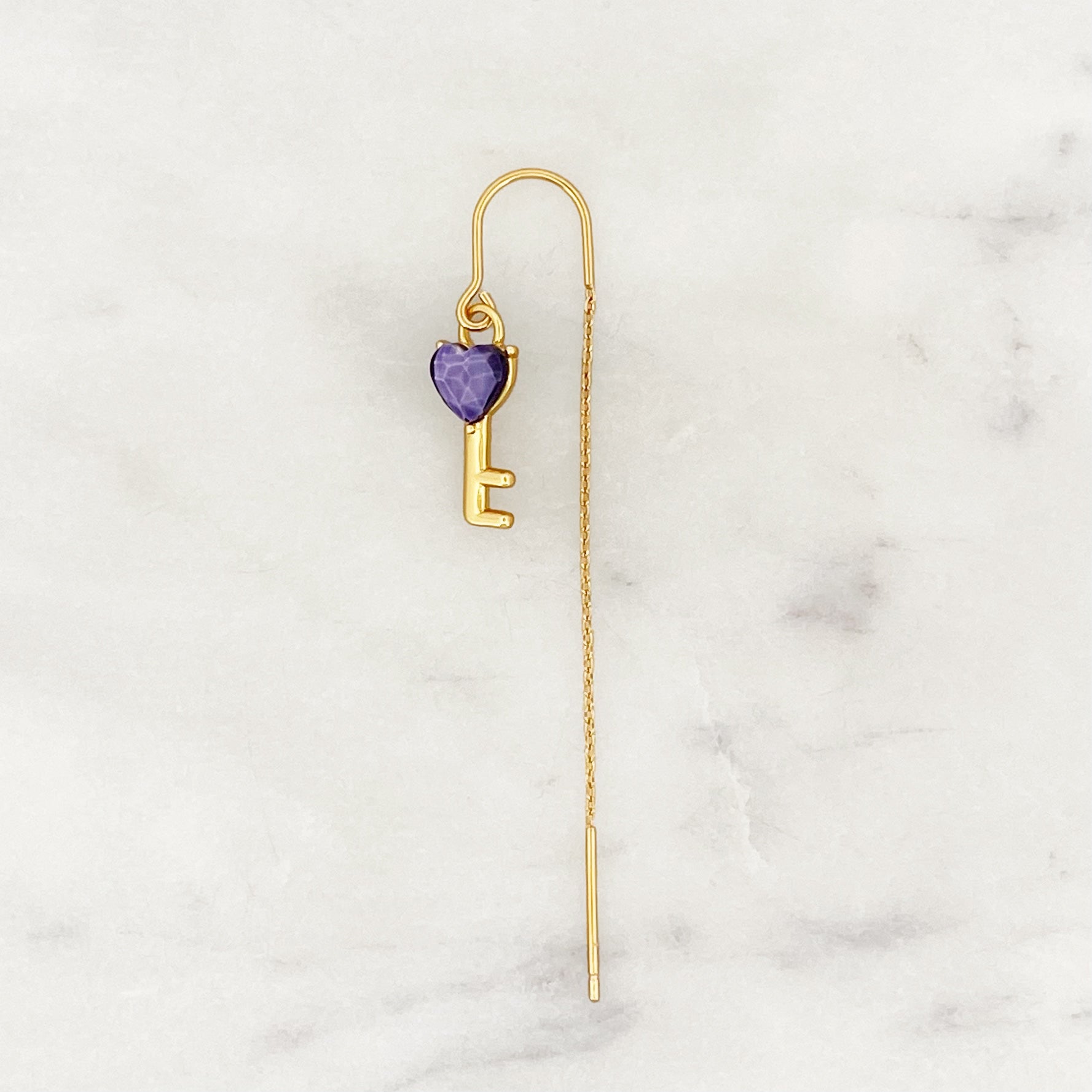 Voorbeeld van een lange ketting met lila liefdessleutel Voorbeeld van een lange ketting met lila liefdessleutel